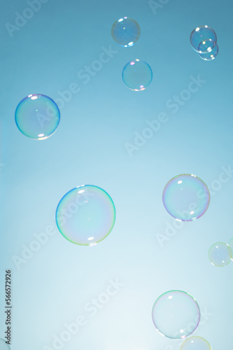 Soap Bubbles on A Blue Natural Background. Soap Sud Bubbles Water. Bubbles background