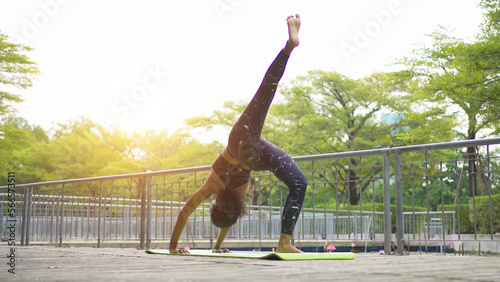 Portrait of Black African American woman in yoga class club doing exercise, runing or jogging at public garden park. Outdoor sport and recreation. People lifestyle activity with nature trees view.