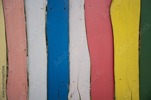 Colorful wooden boards from natural wood. Stripe pattern as a background. Timber in various color.