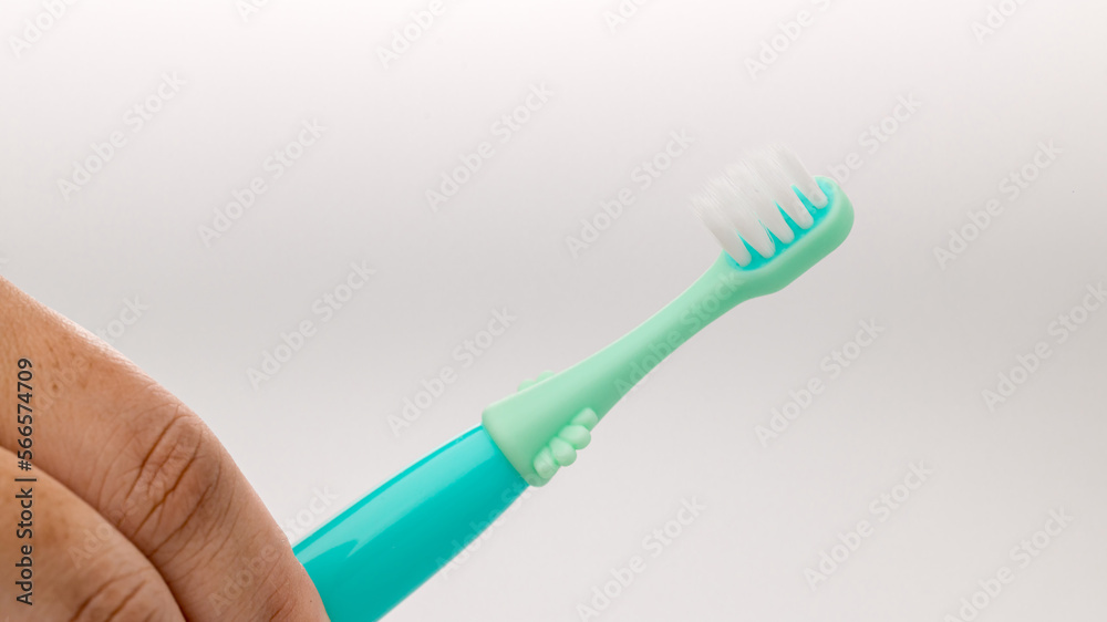 Toothbrush of baby health care. Toothbrush for young baby. children's dental equipment. children teeth brush. Perfect and healthy teeth concept Toothbrush of baby health care. Toothbrush for young baby. children's dental equipment. children teeth brush. Perfect and healthy teeth concept