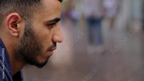 depression, hardship-discouraged young african man bows his head thinking