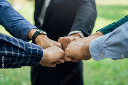 Business people join hands after meeting.World environment day. Global community teamwork.Volunteer charity work.