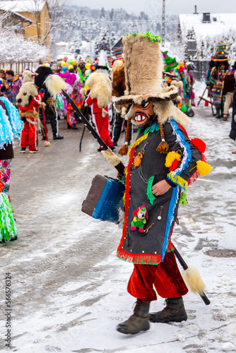 Milowka, Poland, 21.01.2023. Gody Zywieckie - traditional winter parade of 'Dziady', folk custom in Zywiec region, man dressed in traditional colorful costume of a Jew, Milowka, Poland.