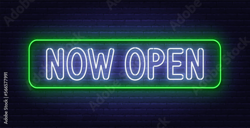 Now Open neon sign on brick wall background.