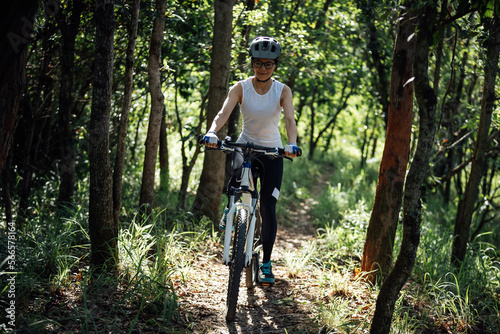 Mountain biking in summer forest