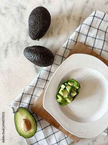 Ripe avocado fruit on plate ready to eating