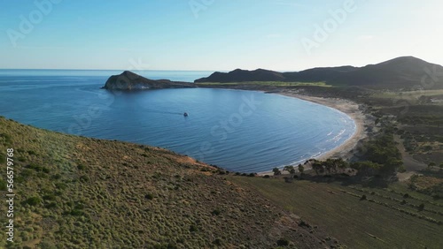 Boat Sails to Los Genoveses Beach in Cabo de Gata, Almeria, Andalusia, Spain - Aerial 4k