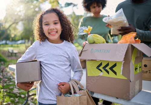 Food, donation and portrait of child in park with smile and grocery box, healthy diet at refugee feeding project. Girl, charity and donations help feed children and support from farm volunteer at ngo