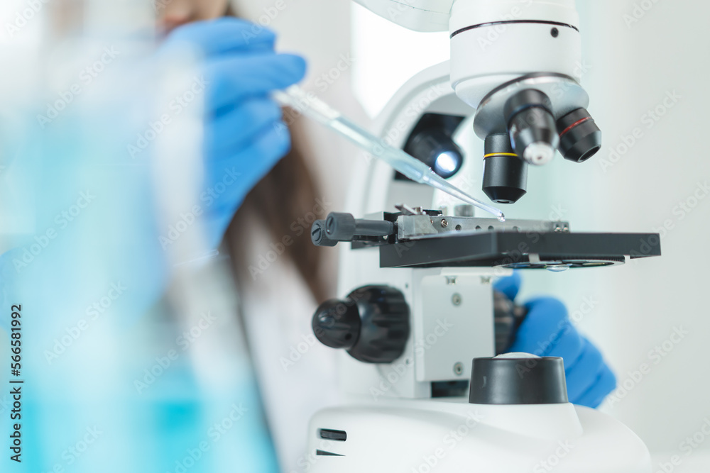 researcher using microscope analyse cell in medical lab. researcher using microscope analyse cell in medical lab.