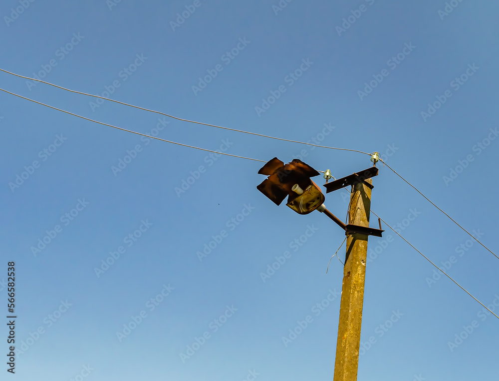 Power electric pole with line wire on colored background close up Power electric pole with line wire on colored background close up