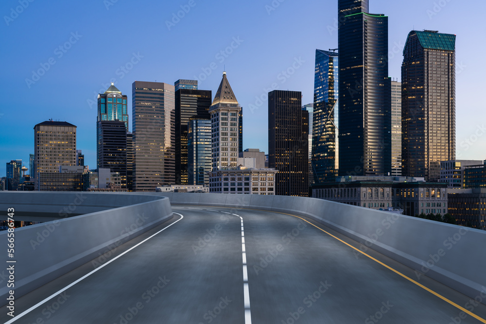 Empty urban asphalt road exterior with city buildings background. New modern highway concrete construction. Concept way to success. Transportation logistic industry fast delivery. Seattle. USA. Empty urban asphalt road exterior with city buildings background. New modern highway concrete construction. Concept way to success. Transportation logistic industry fast delivery. Seattle. USA.
