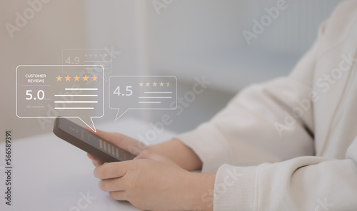 Client woman hand using smartphone with popup five star icon for feedback review satisfaction service, Customer service experience and business satisfaction survey.