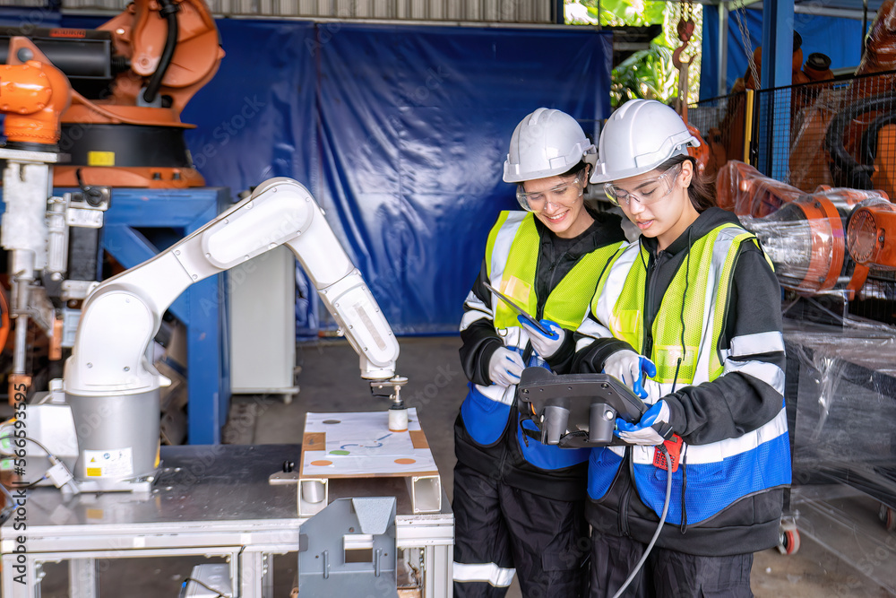 custom made wallpaper toronto digitalWomen engineer team together at work in modern advanced robot welding machine sell service factory
