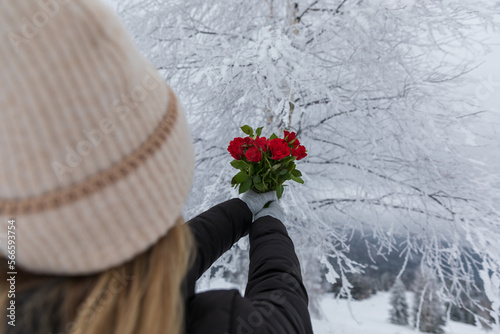 Woman holding a bouquet of ...