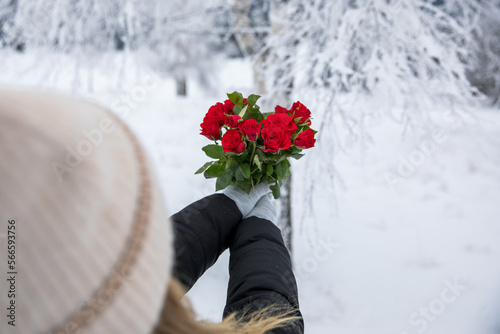 Red roses in the hands of a...