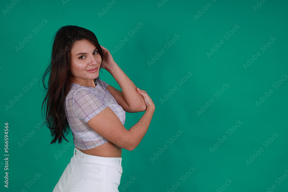 Beautiful brunette woman on green background Beautiful brunette woman on green background