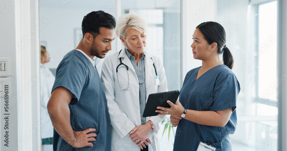 Fototapeta premium Doctor, team and tablet in discussion with senior for healthcare training, advise or support at hospital. Medical professionals with touchscreen in conversation, collaboration or teamwork at clinic