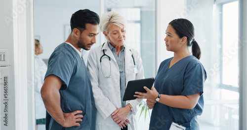 Doctor, team and tablet in discussion with senior for healthcare training, advise or support at hospital. Medical professionals with touchscreen in conversation, collaboration or teamwork at clinic