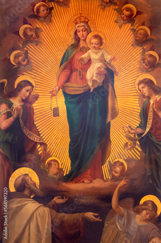 Quadro su tela BIELLA, ITALY - JULY 15, 2022: The painting of Madonna of Scapular as the helper of souls in purgatory with the St