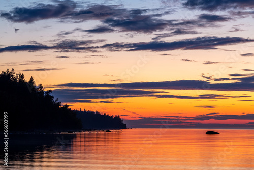 sunset over the lake, calm and bright sky karelia