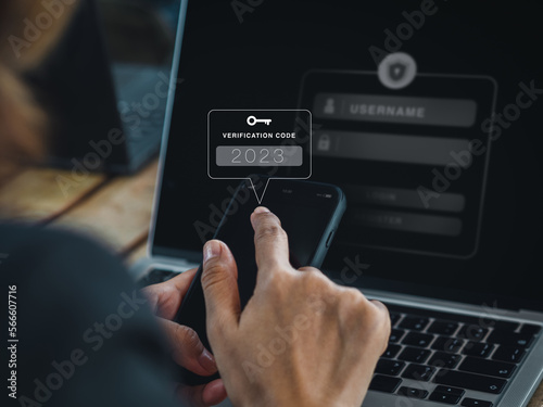 Two steps authentication (2FA) concept. 2023, Verification code and key icon alert on smart phone while using computer for validate password page, Identity verification, cyber security technology.