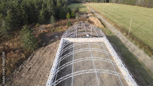 Aerial view of the first stages of the construction of a commercial dome.  Steel structure. Innovative. Hoop building. Agricultural storage. Early stages of the construction of Fabric building. Dome.