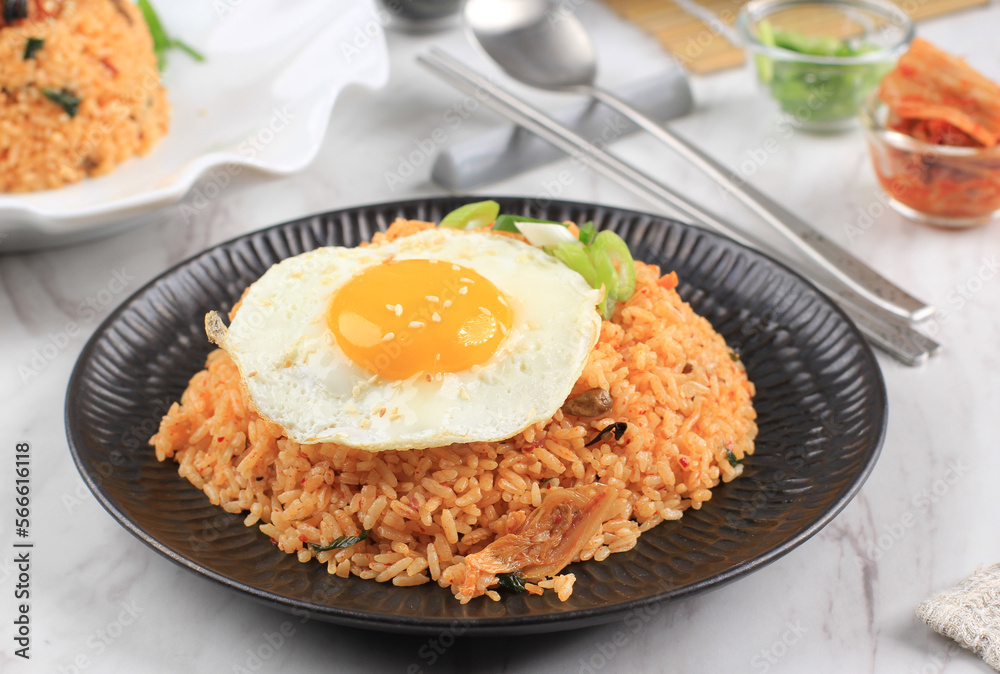 Kimchi Fried Rice with Fried Sunny Side Egg on Top. Korean Food. Kimchi Fried Rice with Fried Sunny Side Egg on Top. Korean Food.