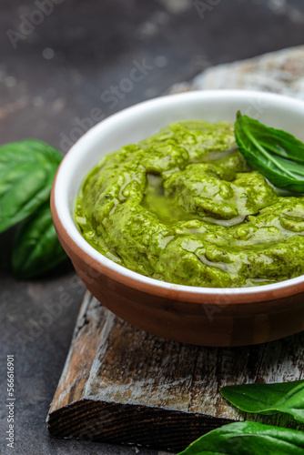 Homemade pesto sauce and ingredients, Traditional Italian pesto recipe for pasta on a dark background, vertical image. top view. place for text
