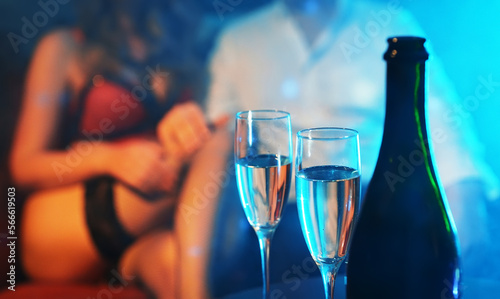 Woman flirting with man in strip club.