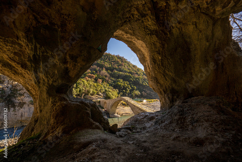 Old stone bridge with arch shape photographed during sunset. photo taken in Permet Albania