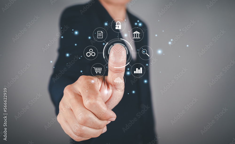 Businessman scans fingerprints provides secure access with biometric identification, internet identification, surveillance and security scanning of digital programs cyber futuristic applications. Businessman scans fingerprints provides secure access with biometric identification, internet identification, surveillance and security scanning of digital programs cyber futuristic applications.