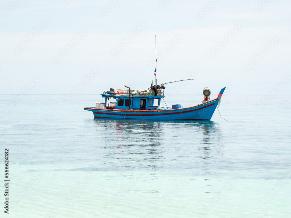 fishing boats between islands in the sea fishing boats between islands in the sea