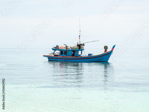 fishing boats between islands in the sea
