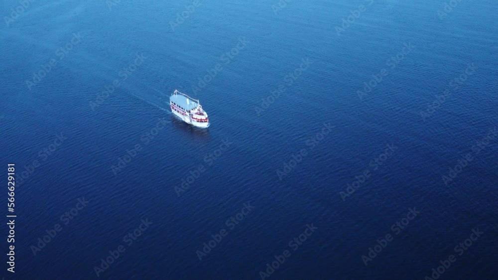 Small tourist boat sailing the sea alone - Aerial view