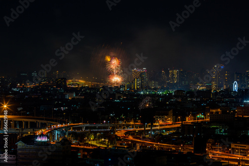 The blurred background of fireworks (light trails) is beautiful at night, seen in the New Year holidays, Christmas events, for tourists to take pictures during public travel. © bangprik