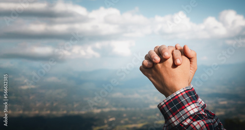 Banner with copy space of woman hands praying to god on nature background. Panorama of female person worship with faith and love. Concept of Religion, Christianity, faith, peace, hope