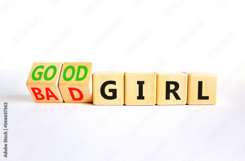 Good or bad girl symbol. Concept word Good girl Bad girl on wooden cubes. Beautiful white table white background. Business psychological good or bad girl concept. Copy space. Good or bad girl symbol. Concept word Good girl Bad girl on wooden cubes. Beautiful white table white background. Business psychological good or bad girl concept. Copy space.