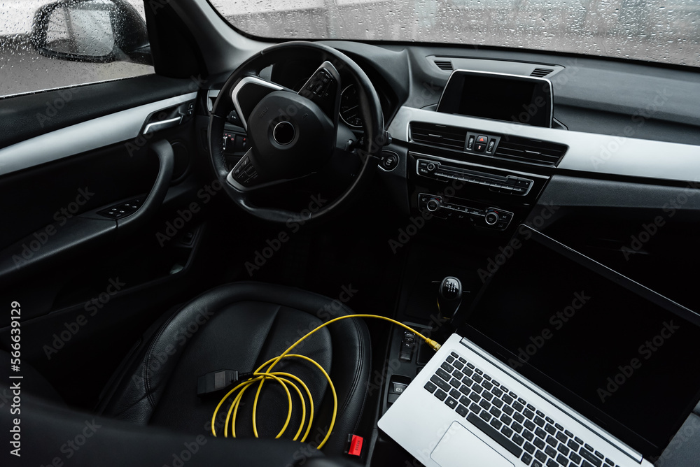 Fototapeta premium Car diagnostics with laptop computer in car.