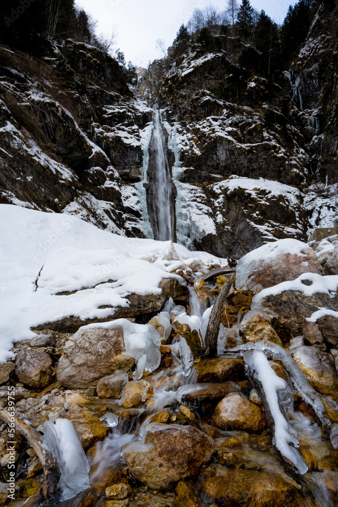 Shot at the frozen waterfall with snow and chunks of ice as a side dish. Candid white
