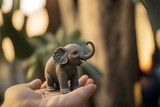Elefante africano baby nel palmo di una mano, generative ai