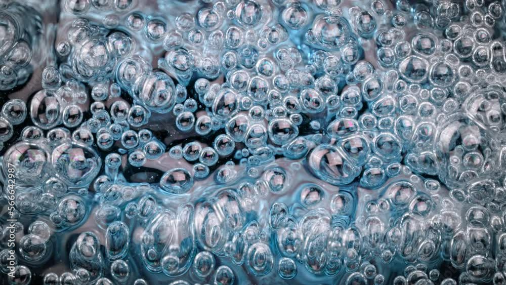 Super Slow Motion Shot of Oil Bubbles in Blue Water at 1000fps. Super Slow Motion Shot of Oil Bubbles in Blue Water at 1000fps.