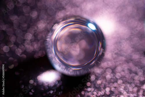 Fuchsia abstract background with bokeh balls and defocused glitter photo