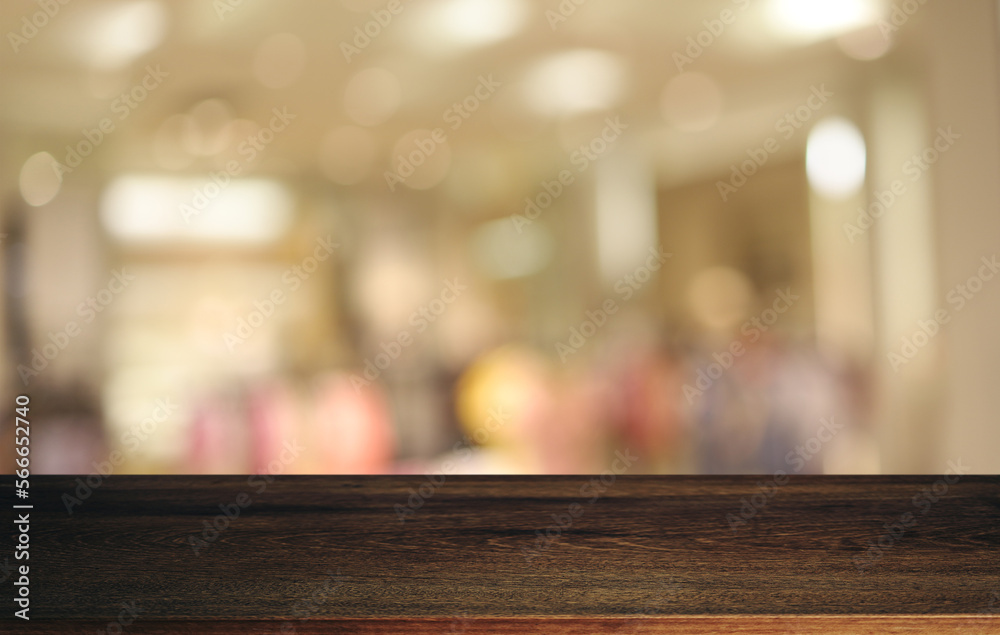 Empty wooden table in front of abstract blurred background of coffee shop . can be used for display or montage your products.Mock up for display of product