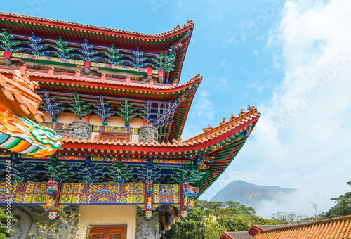 Photography Colorful Chinese temple roof with blue sky background, Hong Kong.
