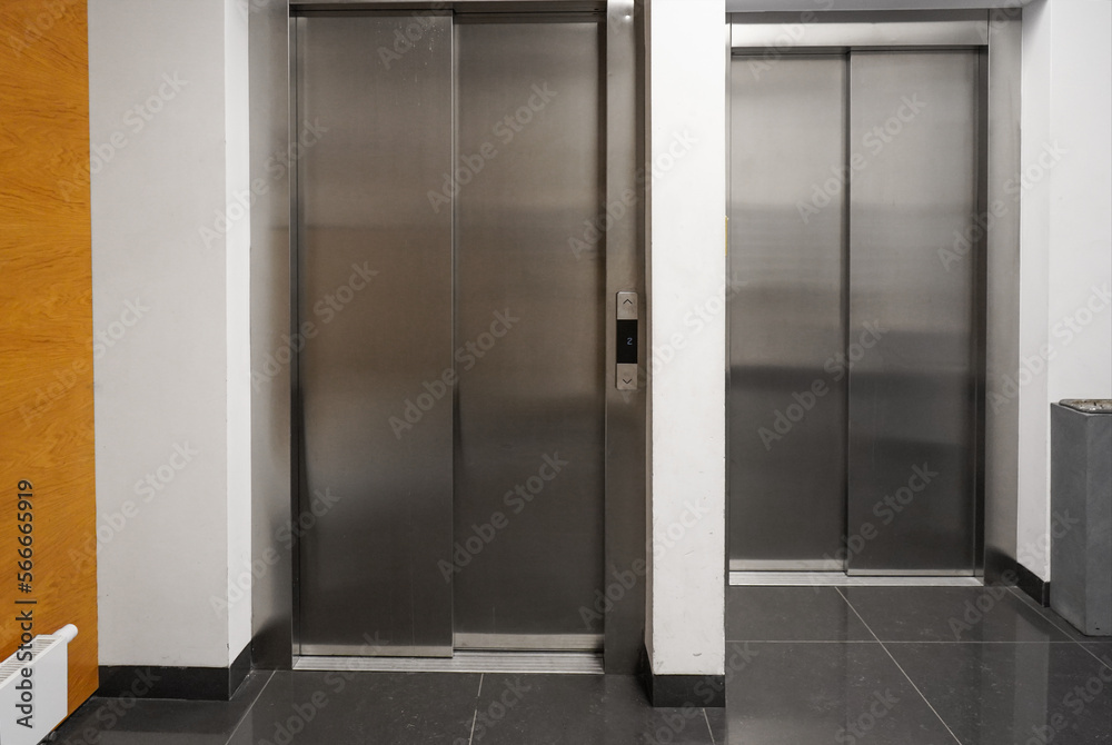chrome elevators in multi apartment modern house. elevator breakdown. Freight elevator and normal. chrome elevators in multi apartment modern house. elevator breakdown. Freight elevator and normal.