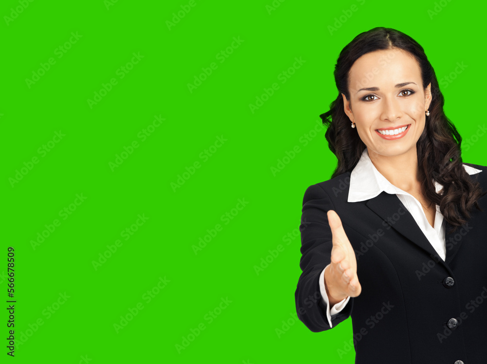 Happy smiling young beautiful business woman in black confident suit and white blouse, giving hand for handshake. Green chroma key background. Happy smiling young beautiful business woman in black confident suit and white blouse, giving hand for handshake. Green chroma key background.