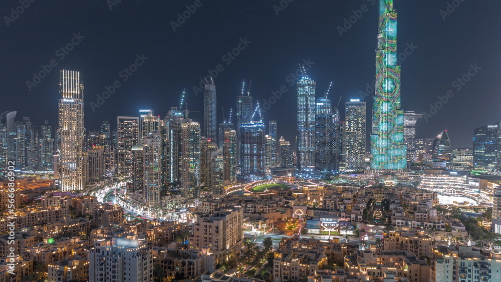 Dubai Downtown night with tallest skyscraper and other towers