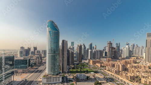 Panorama showing Dubai s business bay towers aerial morning . Rooftop view of some skyscrapers