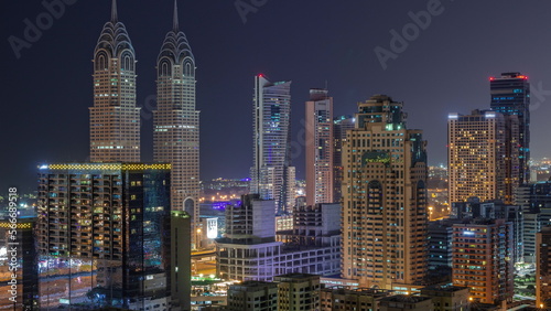 Skyscrapers in Barsha Heights district and internet city towers aerial during all night .