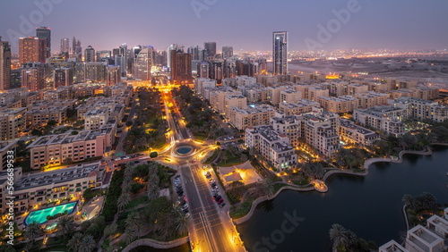 Photography Skyscrapers in Barsha Heights district and low rise buildings in Greens district aerial day to night